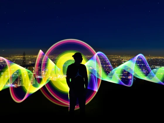 man with colorful wave energy background